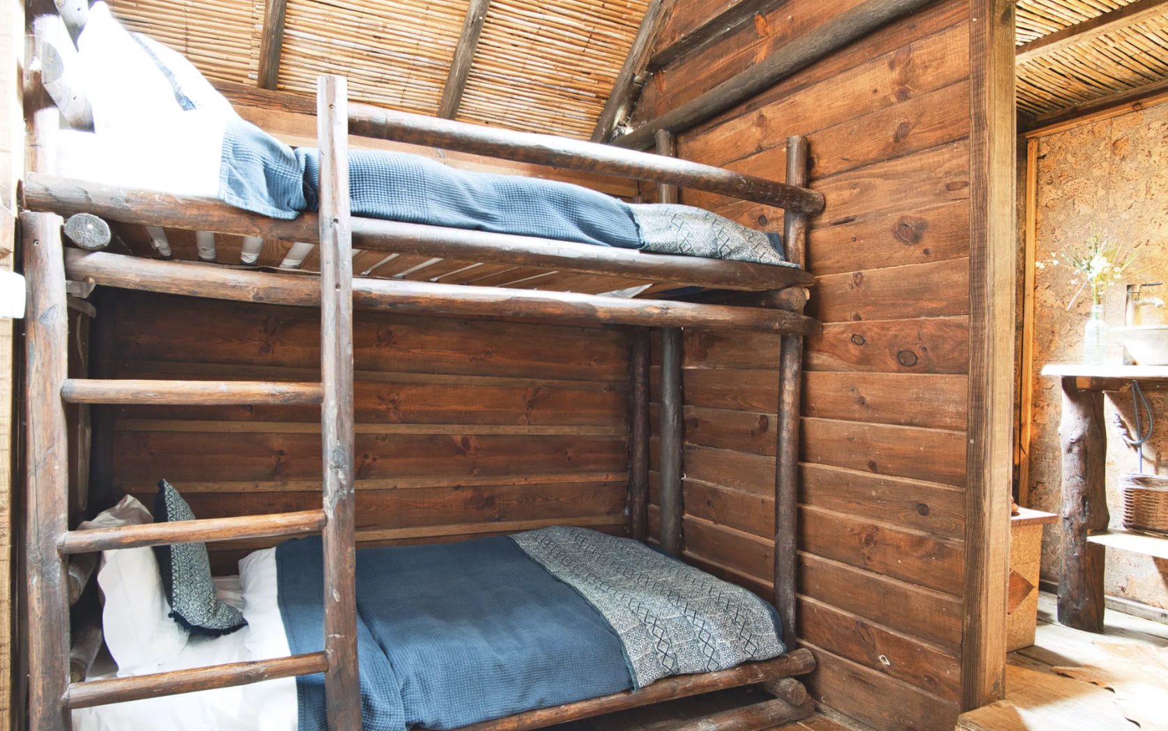 Wooden bunk beds in family cabin at Aterra