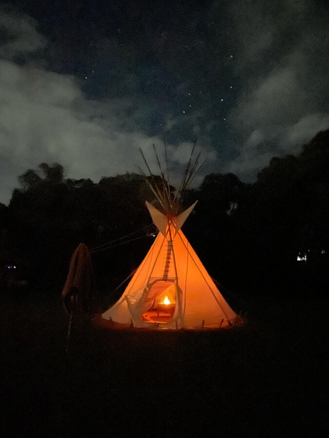 Sunshine tipi at night under stars