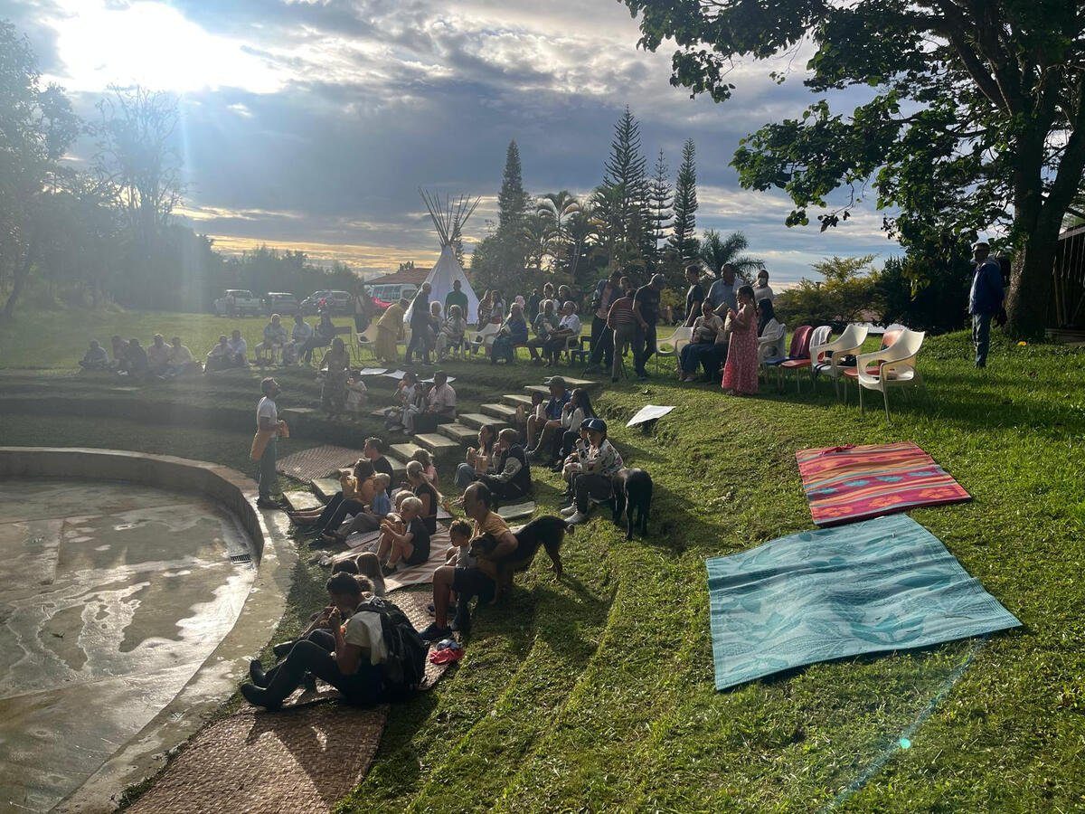 Evening gathering at Casa Sumapaz with families sitting together