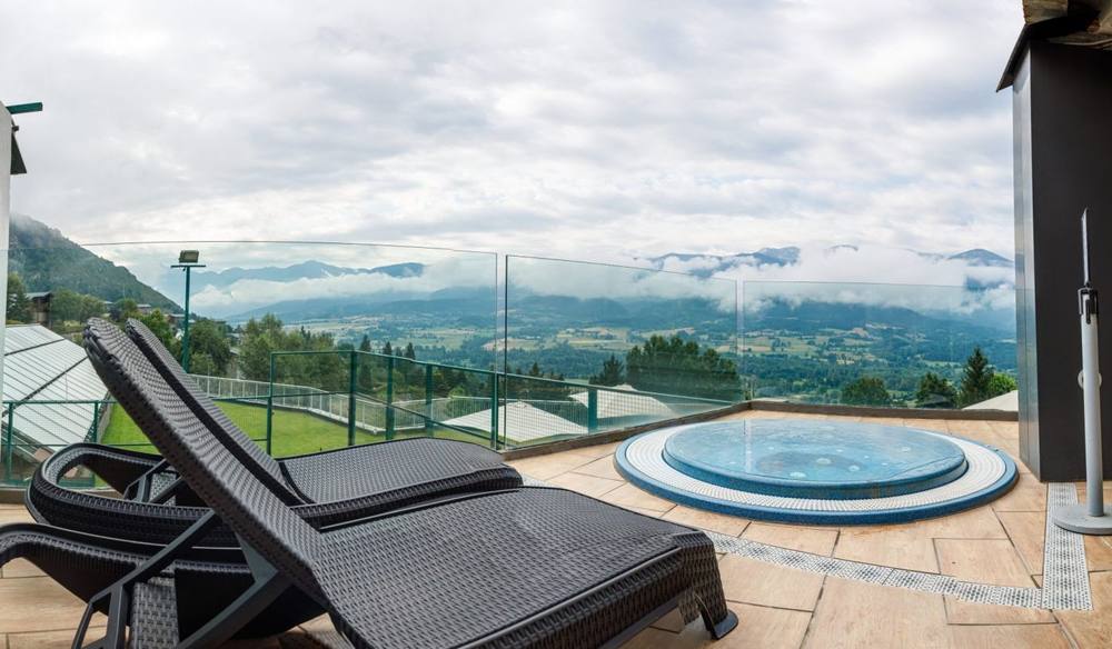 Sun loungers on a terrace overlooking the Cerdanya valley